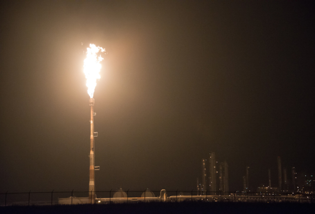 Oil refinery flaring at night in Brazoria County Texas